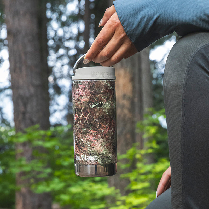 12oz-tkwide-with-cafe-cap-mossy-oak-u2 12oz_tumbler_mossyoak_rainbowtrout_hand_closeup_square.jpg