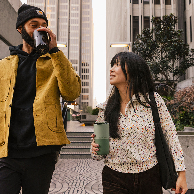bring-your-own-party-kit-pints-and-tumblers-b9 16oz_rise_tumbler_black_iceberg_couple_drink_city_street_square.jpg