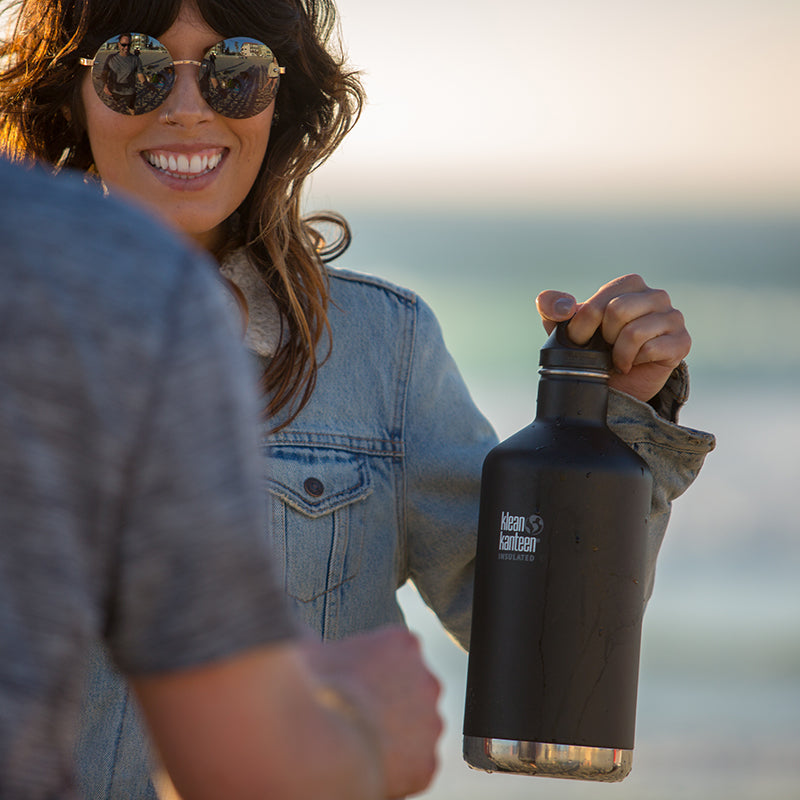 64oz-classic-with-loop-cap-a6 64oz_insulated_classic_black_beach_girl_hand_square.jpg