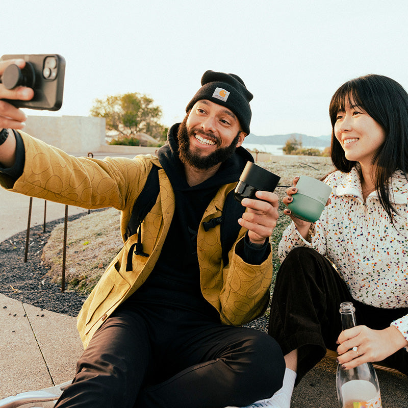 bring-your-own-party-kit-tumblers-and-cocktails-r3 8oz_rise_lowball_black_iceberg_couple_selfie_city_square.jpg