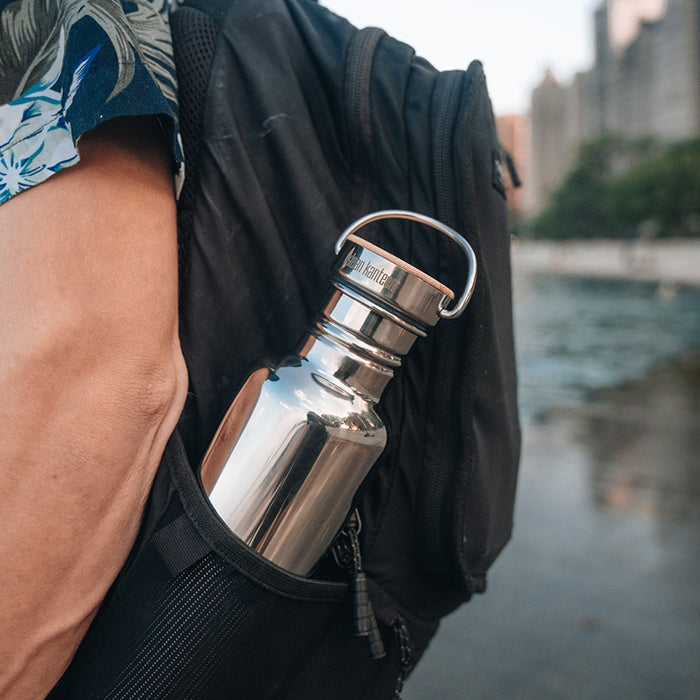 27oz-reflect-with-bamboo-cap-k8 K27SSLRF-MS-BAMBOO_reflect-bottle_backpack_lifestyle.jpg