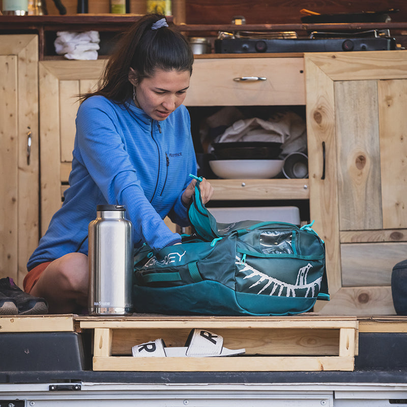 64oz-tkwide-with-loop-cap-q7 tkwide_64oz_bottle_campervan_woman_packing_square.jpg